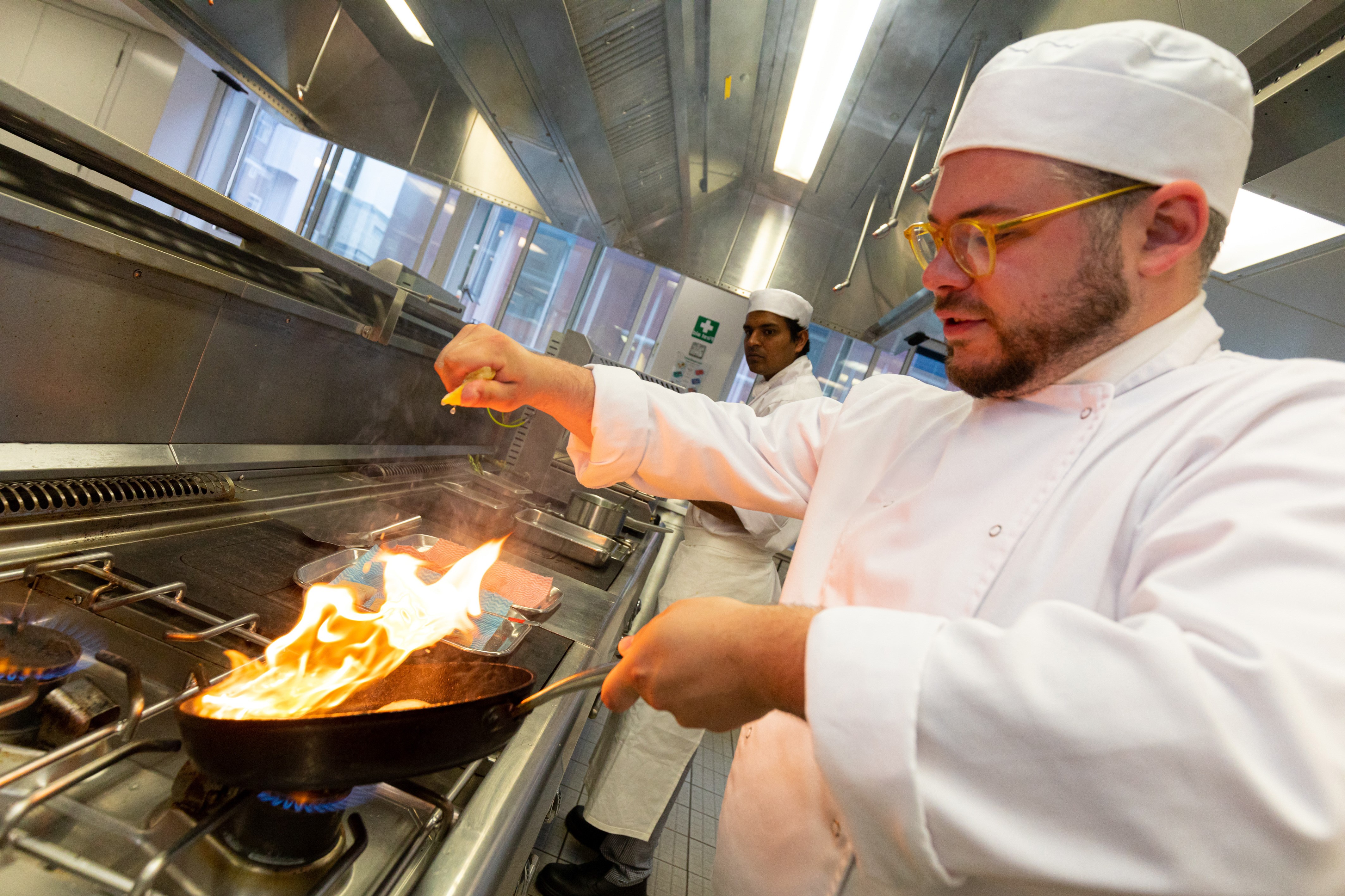 Chef de partie cooking in kichen at UCB