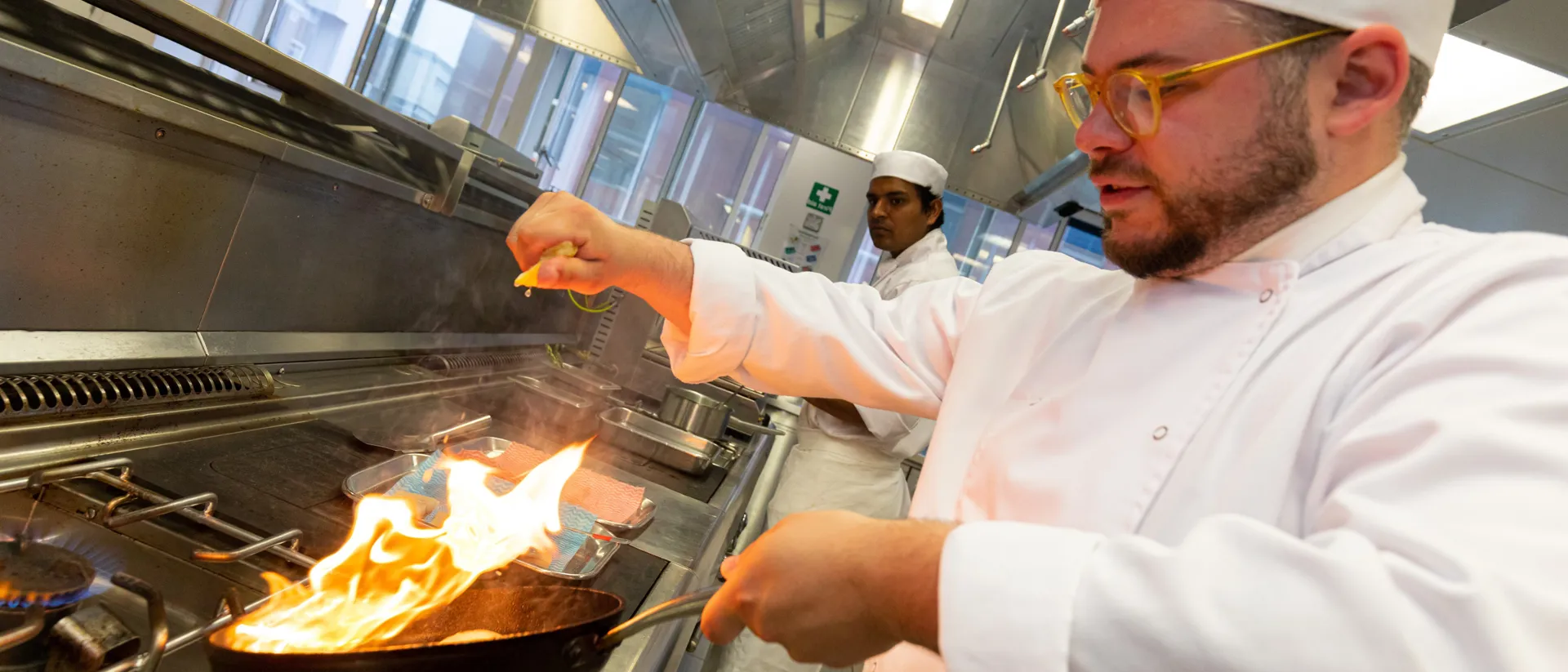 Chef de partie cooking in kichen at UCB