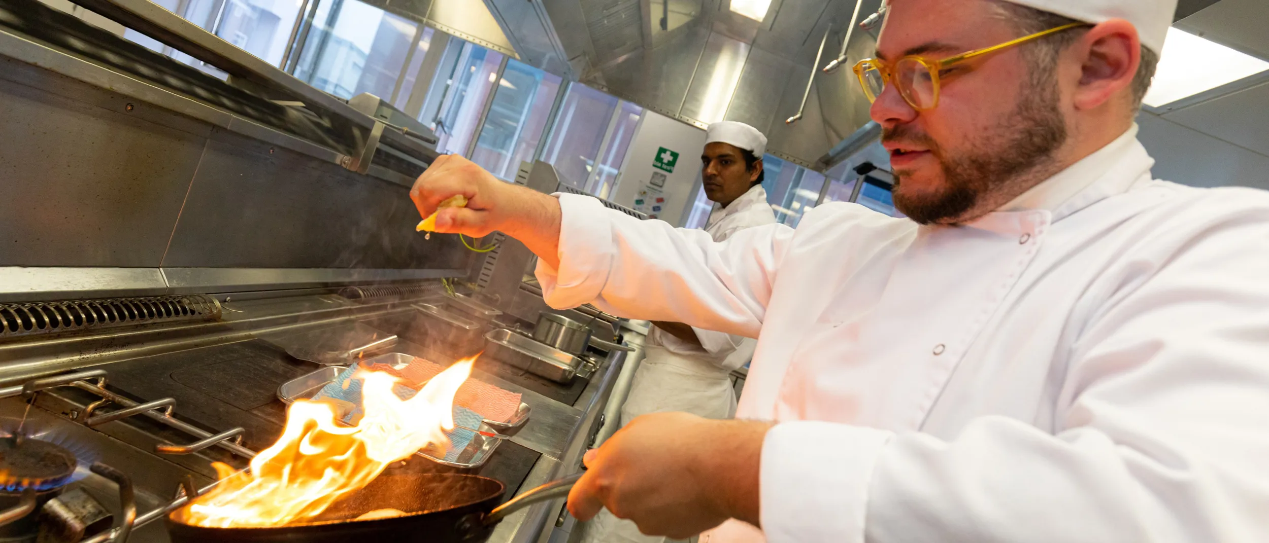 Chef de partie cooking in kichen at UCB