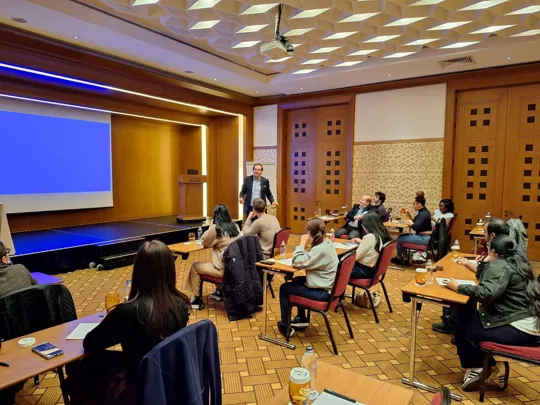 Students listening to a finance expert talk in instanbul
