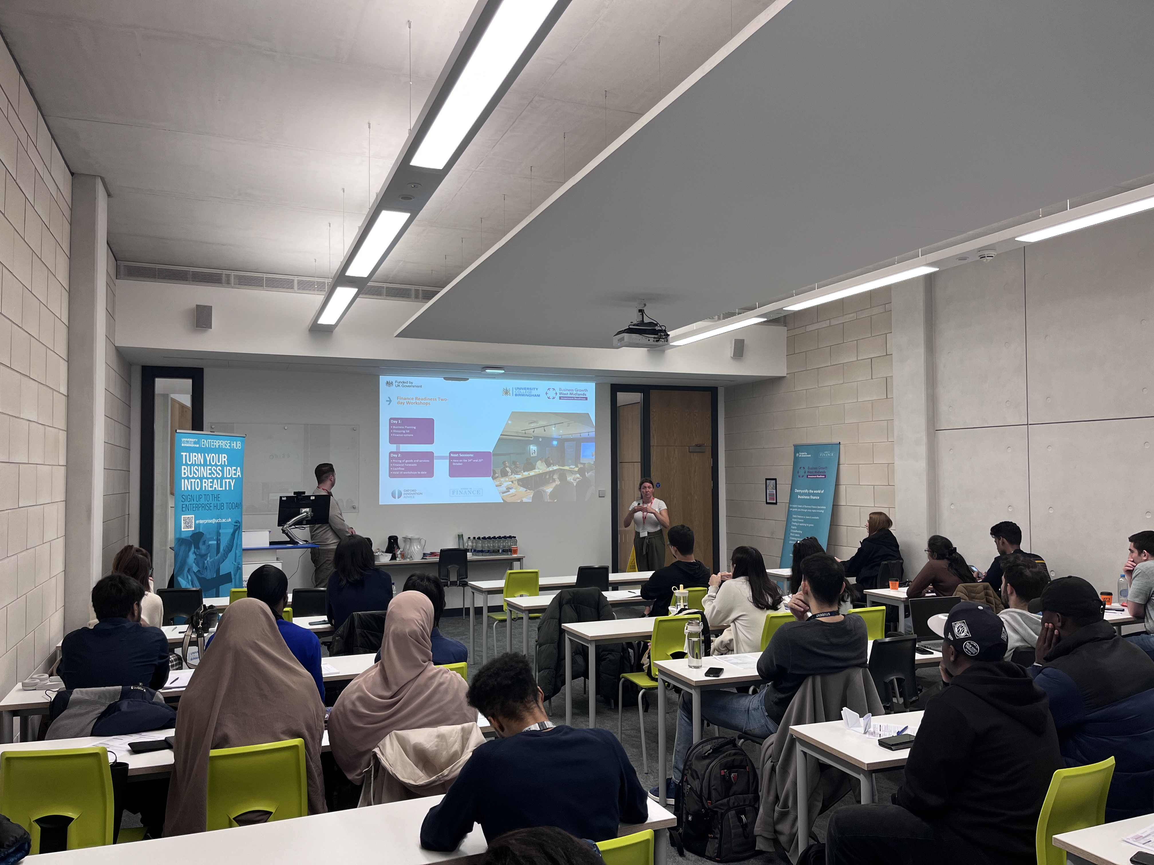 classroom of students listening to a guest speaking sessions.