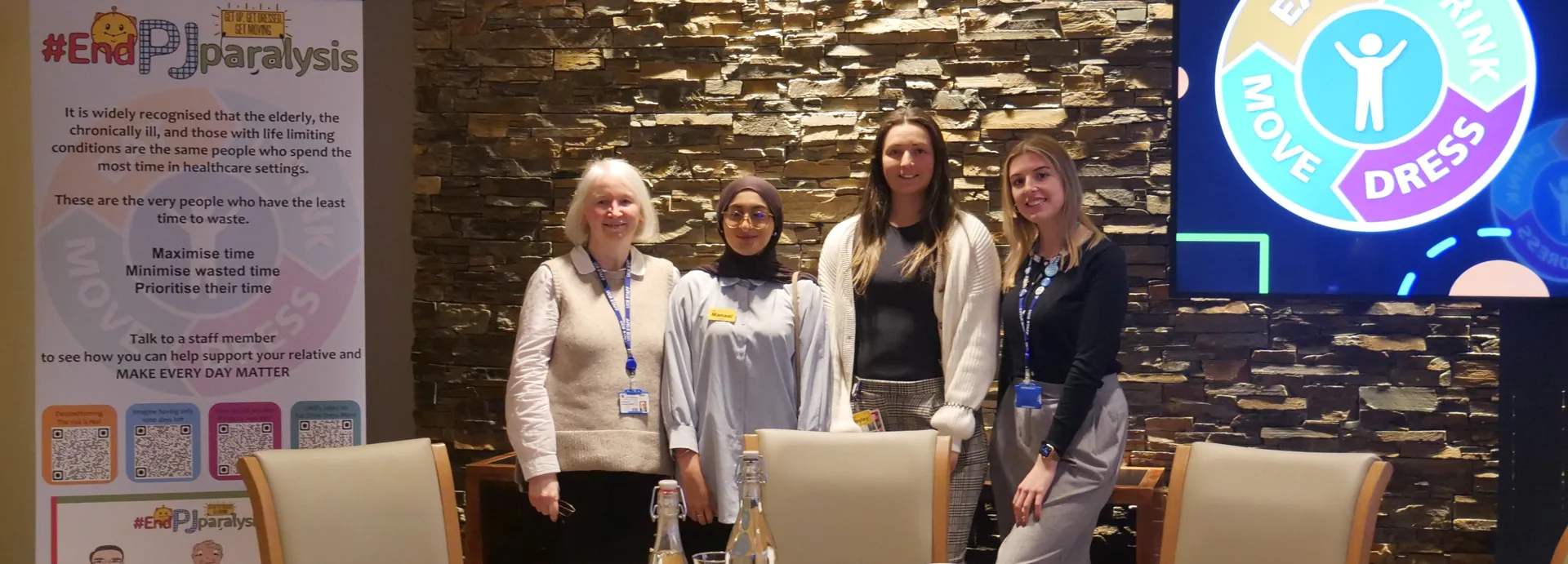 Two University College Birmingham lecturers gather round two guest speakers at a dietetics global tea party event