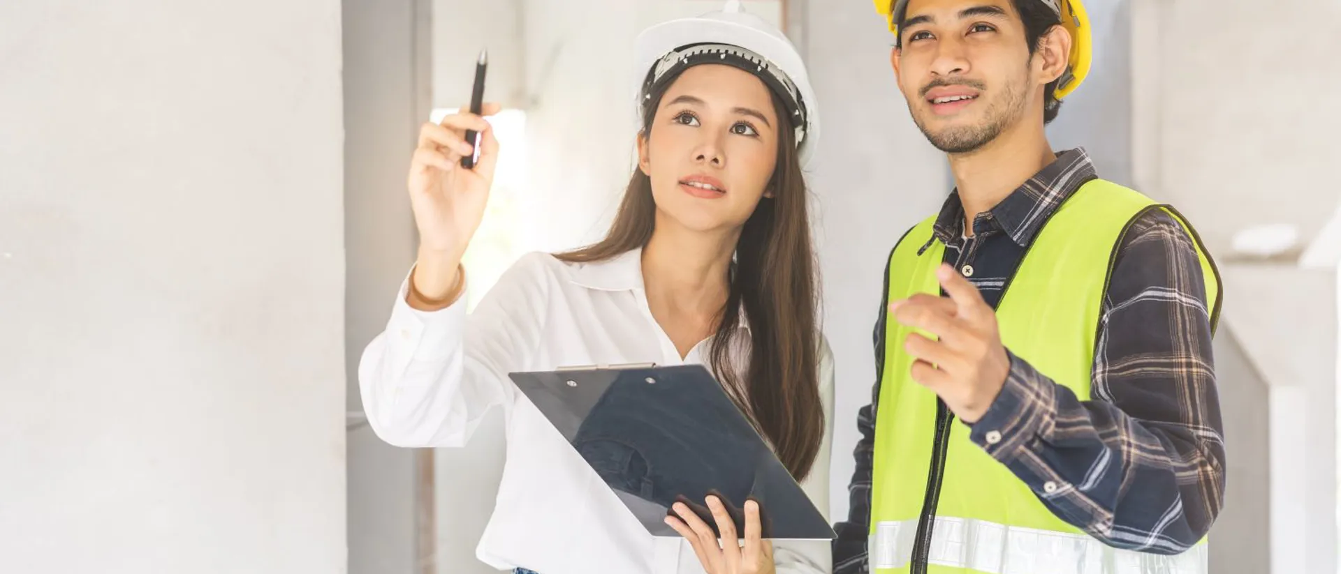Two construction students evaluating a project.