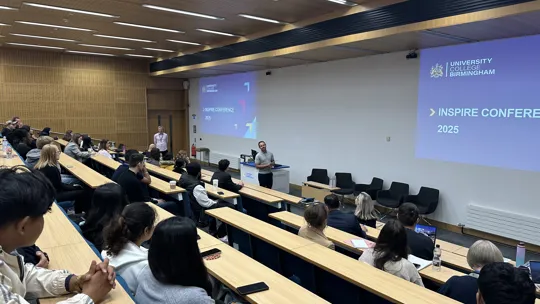 HoD Ricky Behan opening the inspire conference at the front of a lecture theatre