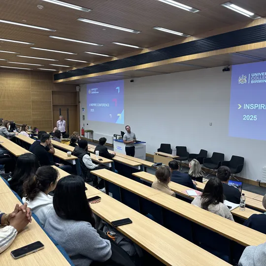 HoD Ricky Behan opening the inspire conference at the front of a lecture theatre