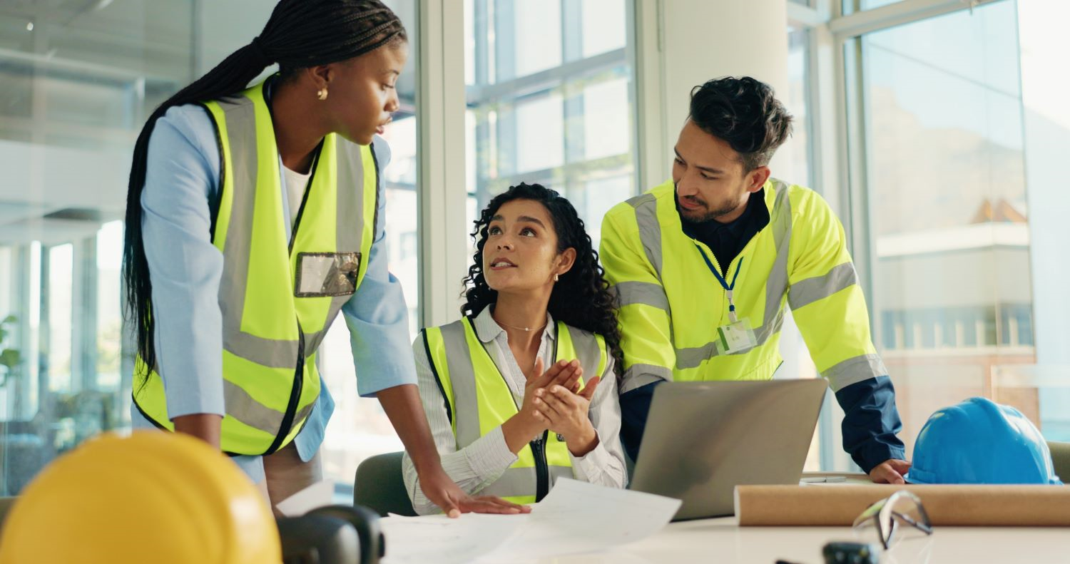 Group of construction student collaborating over a laptop