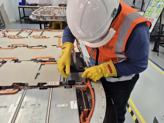 Student working on a battery.