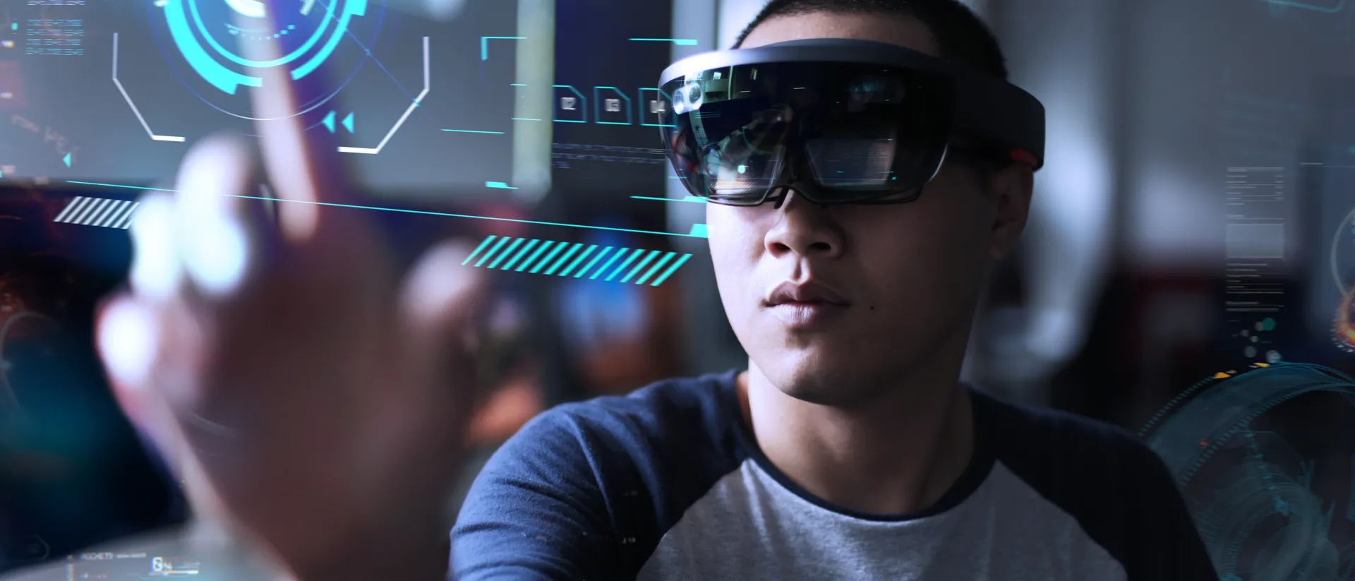 Male wear a virtual reality headset clicking on to a virtual screen.