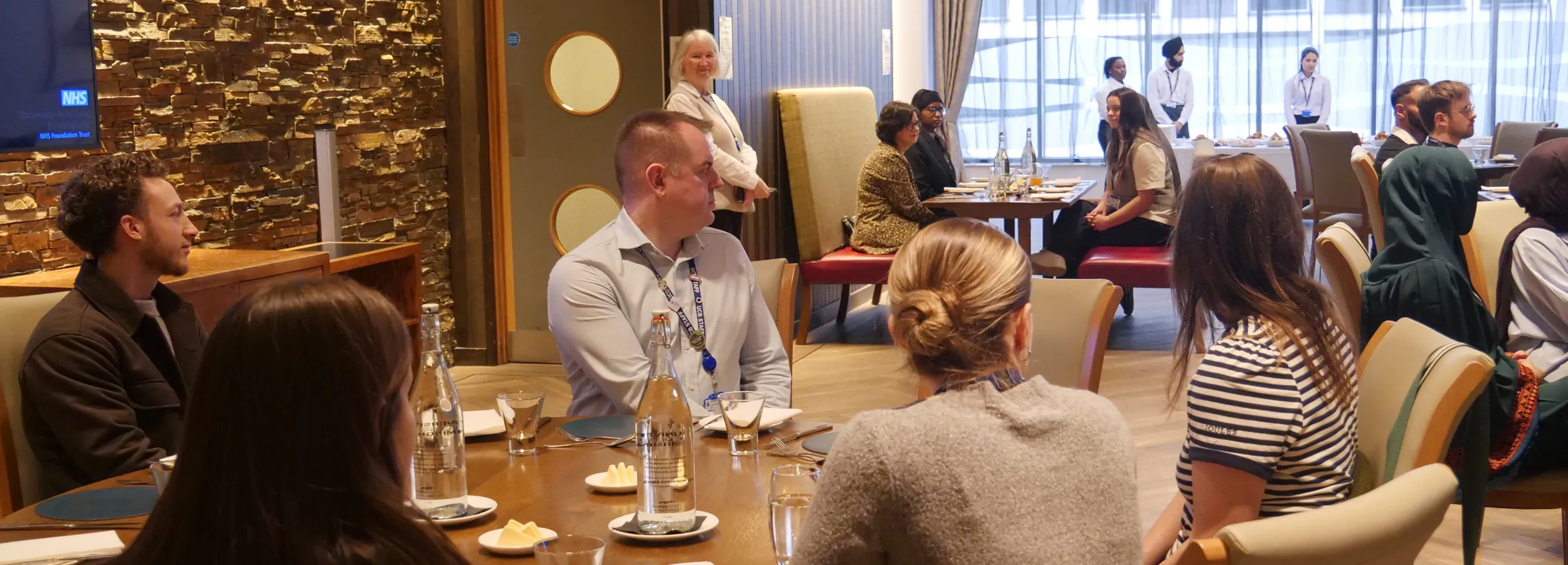 Colleagues and guests gather to enjoy lunch at UCB