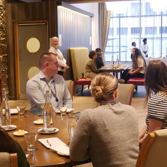 Colleagues and guests gather to enjoy lunch at UCB