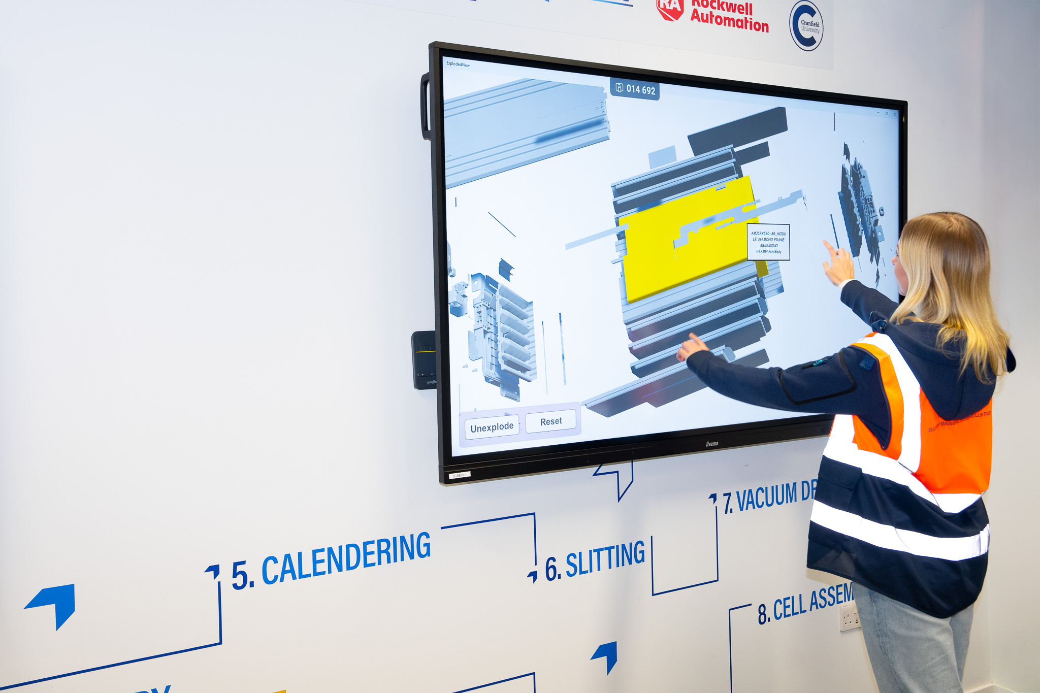 Student working on a battery project on a touch screen.