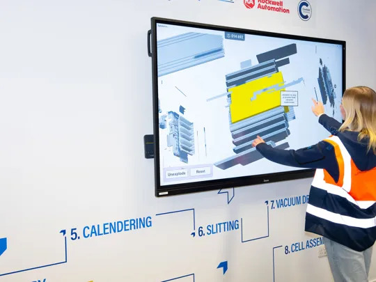 Student working on a battery project on a touch screen.