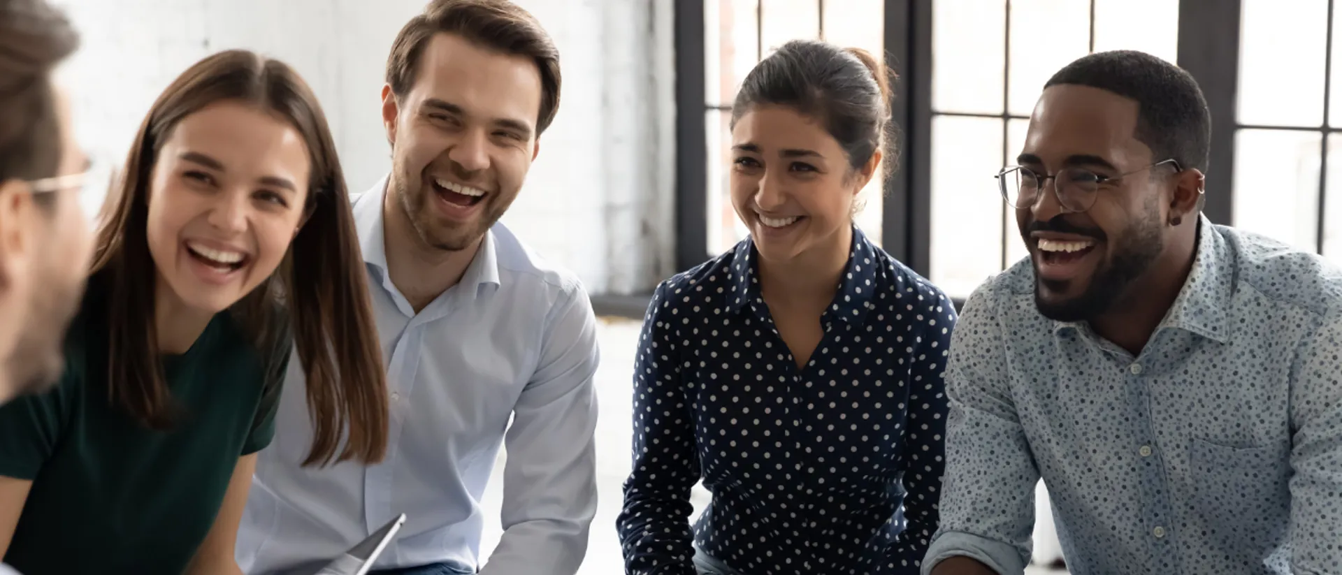 Group of older professional students laughing.